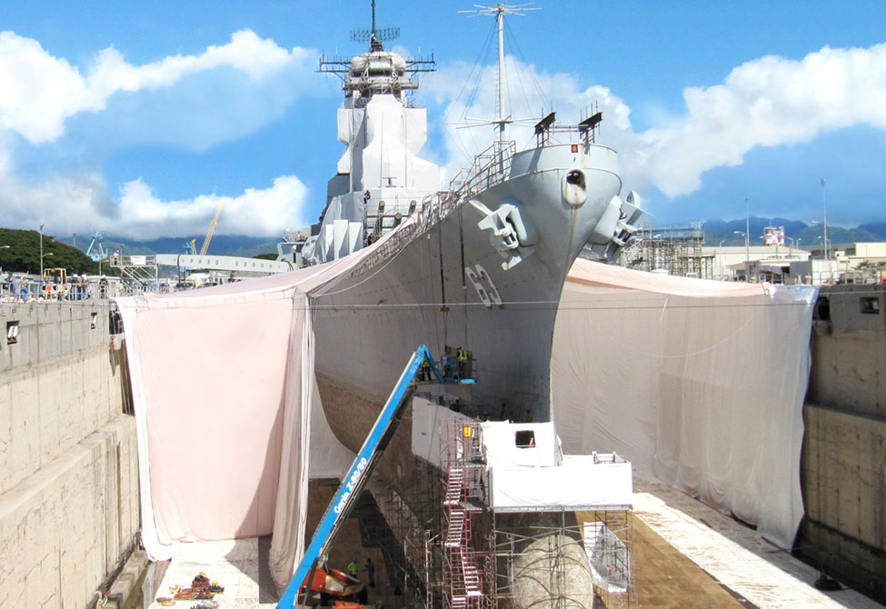 Ship docked for repairs draped in Coated Airbag Tarps